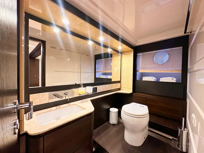 Tamara II Yacht Photos Pics Luxurious bathroom interior of 2018 Azimut 66 FLY yacht, featuring modern fixtures and elegant design.