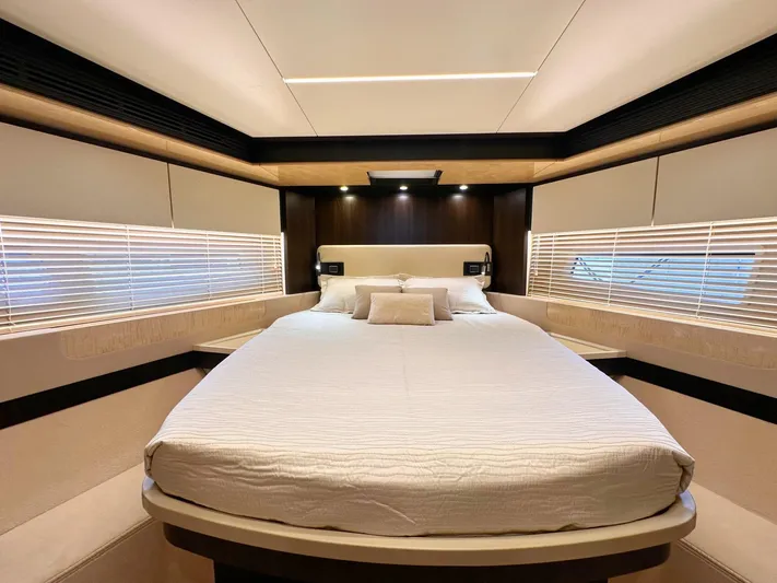 Tamara II Yacht Photos Pics Luxurious bedroom interior of 2018 Azimut 66 FLY yacht with modern design and cozy bedding.