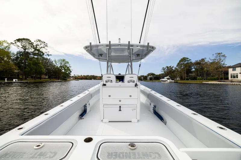  Yacht Photos Pics 2022 Contender 35ST boat on calm water, showcasing spacious deck and sleek design.