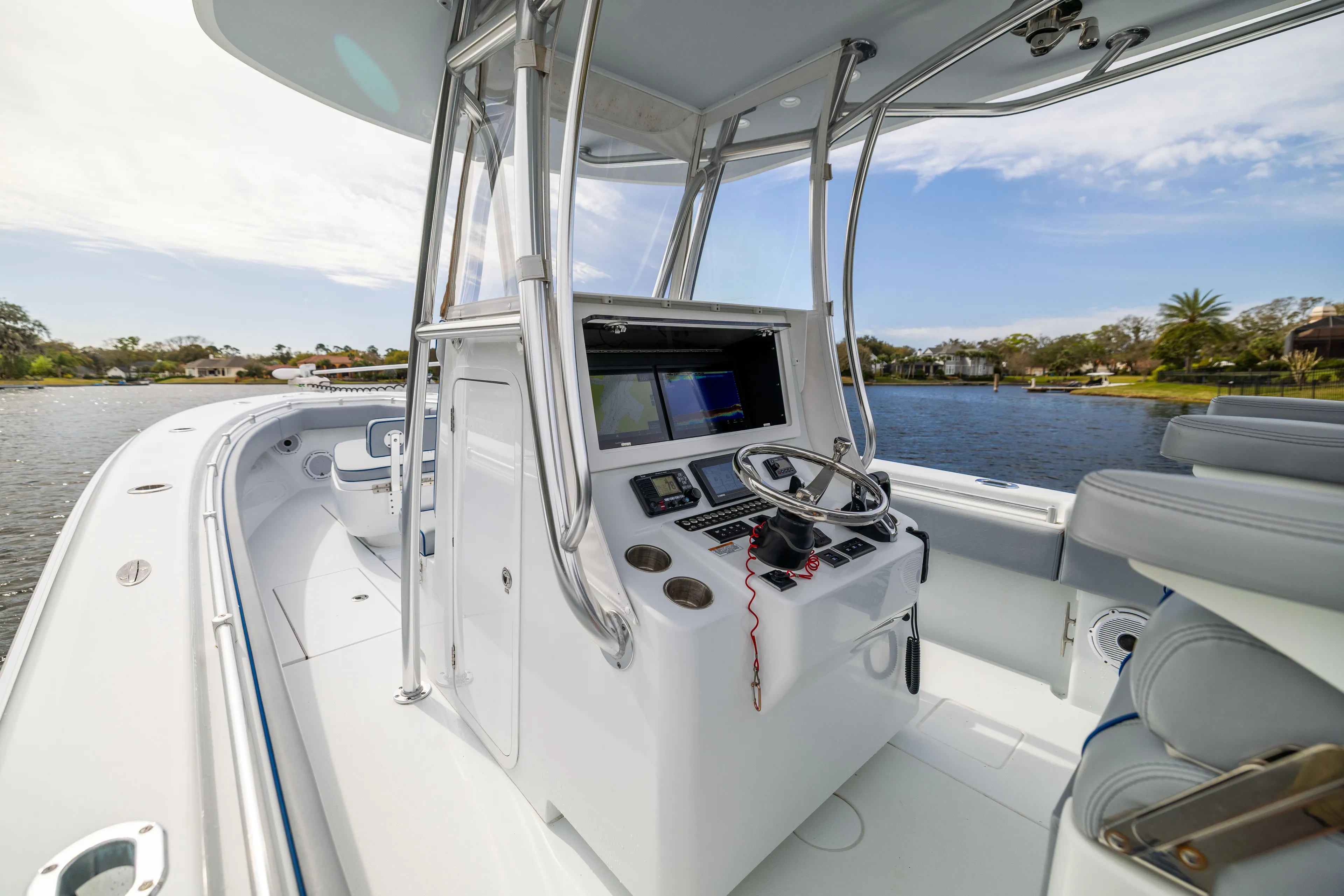  Yacht Photos Pics 2022 Contender 35ST boat interior with modern helm and navigation system.