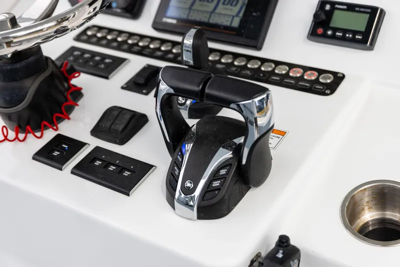  Yacht Photos Pics Control panel of 2022 Contender 35ST boat with throttle and navigation instruments.