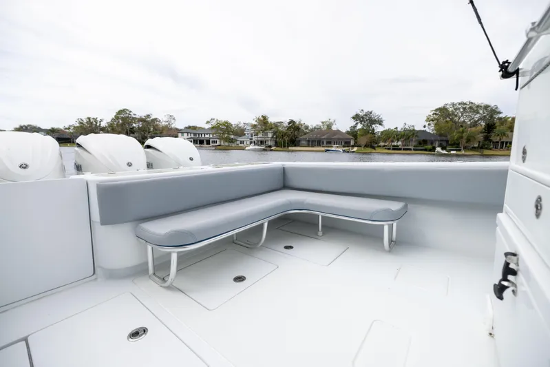  Yacht Photos Pics 2022 Contender 35ST boat with spacious seating area and sleek design.