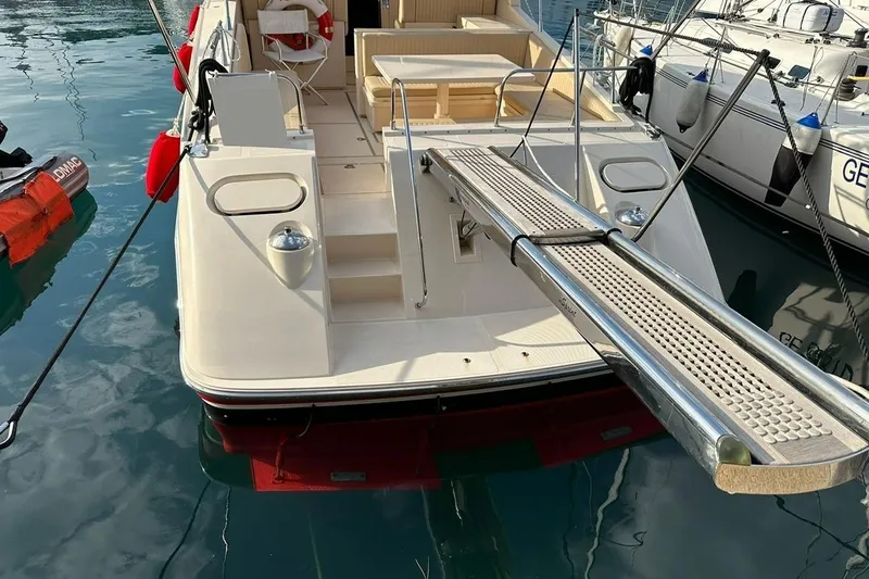  Yacht Photos Pics 1989 Riva 51 Turborosso yacht docked, featuring a sleek design and spacious deck.