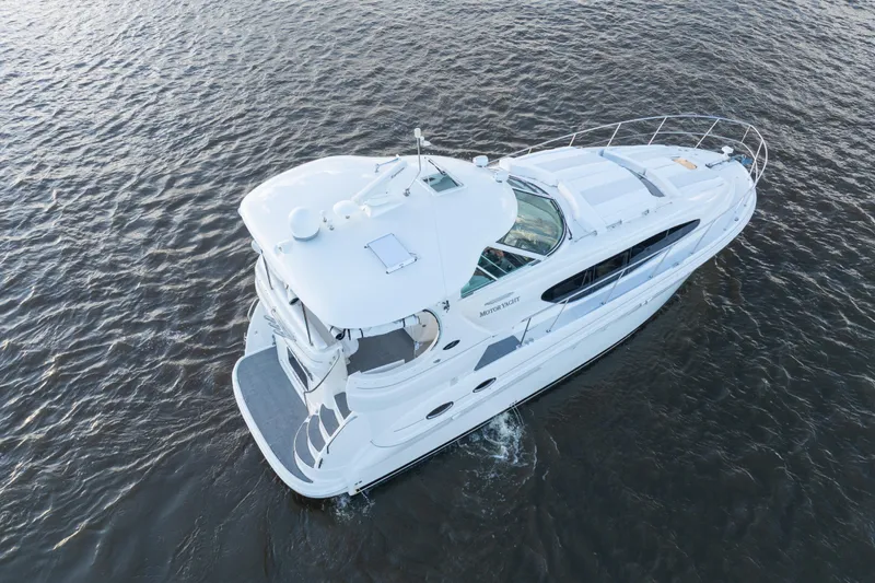  Yacht Photos Pics 2007 Sea Ray 40 Motor Yacht cruising on open water, aerial view.