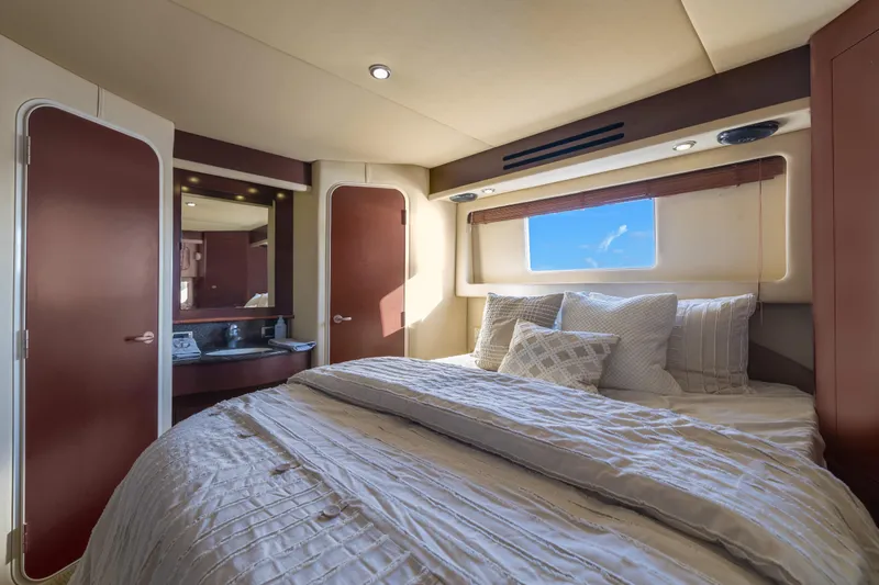  Yacht Photos Pics Luxurious bedroom interior of 2007 Sea Ray 40 Motor Yacht with elegant bedding and window view.