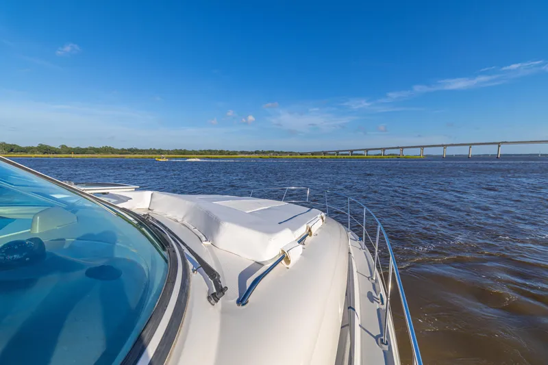  Yacht Photos Pics 2007 Sea Ray 40 Motor Yacht cruising on a sunny day near a bridge.