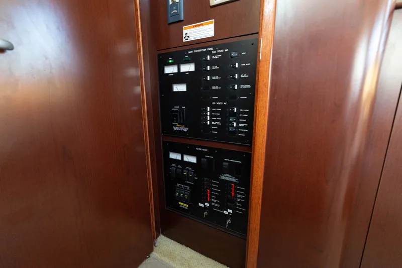  Yacht Photos Pics Electrical control panel inside 2007 Sea Ray 40 Motor Yacht with wooden finish.