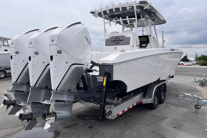  Yacht Photos Pics 2025 Fountain 34 Tournament Edition boat with triple Mercury outboard engines on a trailer.