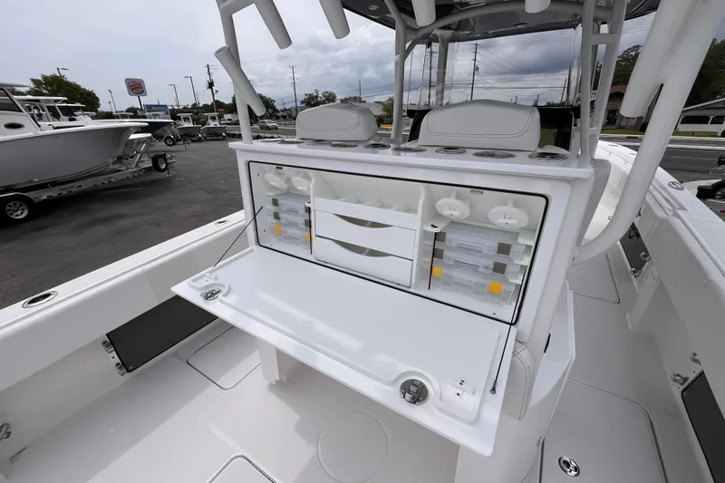  Yacht Photos Pics 2025 Fountain 34 Tournament Edition boat with open storage compartments and seating.