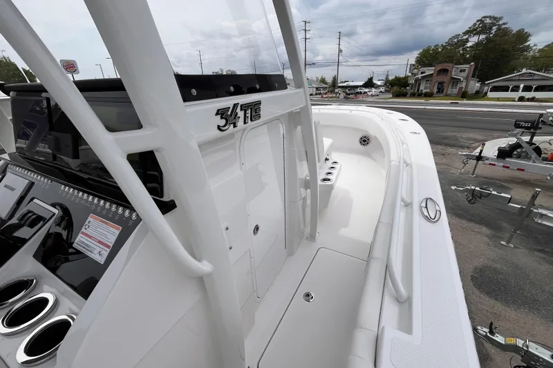  Yacht Photos Pics 2025 Fountain 34 Tournament Edition boat, sleek design, white interior, parked outdoors.