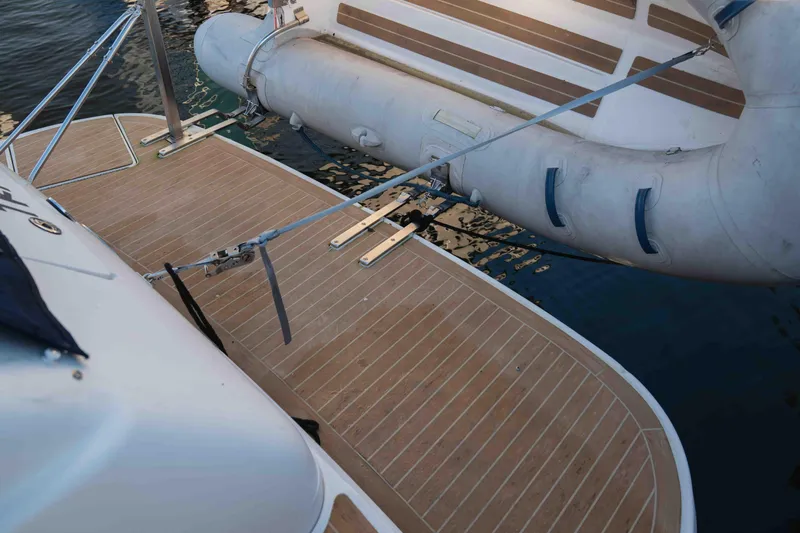  Yacht Photos Pics 2004 Sea Ray 360 Sundancer swim platform with inflatable boat docked nearby.