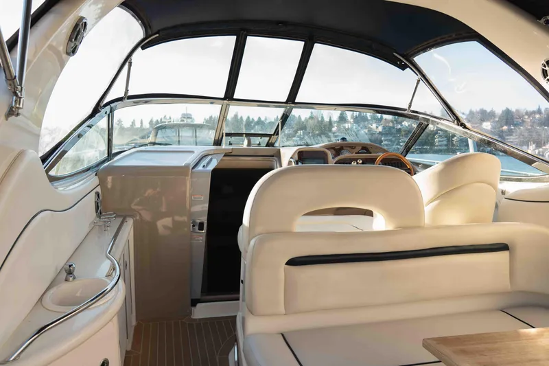  Yacht Photos Pics Interior of 2004 Sea Ray 360 Sundancer yacht with luxurious seating and helm.