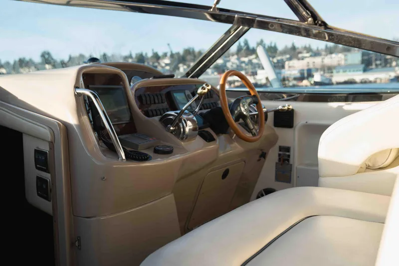  Yacht Photos Pics Interior of 2004 Sea Ray 360 Sundancer yacht with steering wheel and controls.