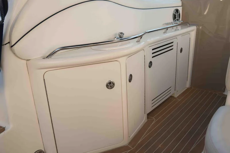  Yacht Photos Pics 2004 Sea Ray 360 Sundancer interior cabinetry with sleek design and wood flooring.