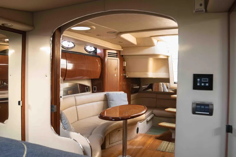  Yacht Photos Pics Luxurious interior of 2004 Sea Ray 360 Sundancer yacht with elegant seating and wooden finishes.