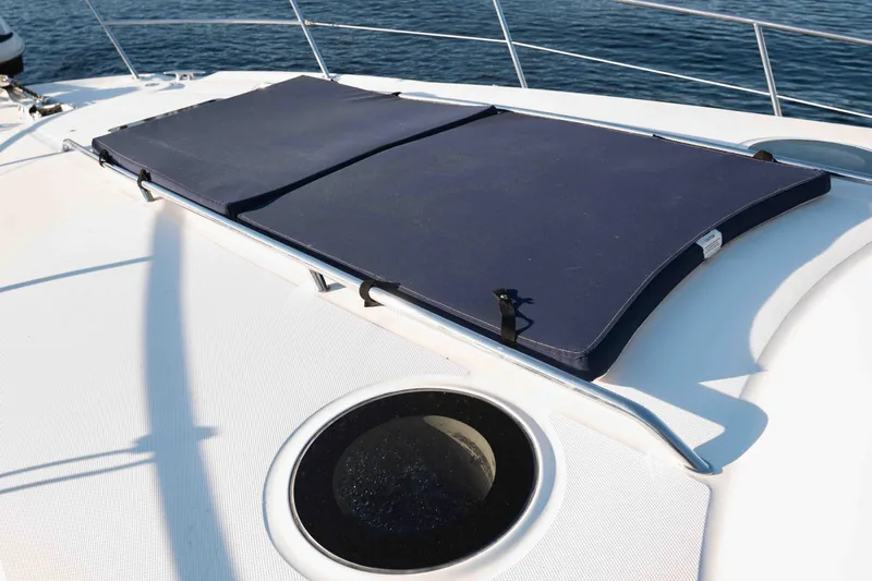  Yacht Photos Pics 2004 Sea Ray 360 Sundancer deck with blue sun pads and ocean view.