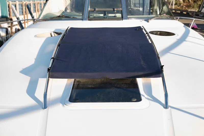  Yacht Photos Pics 2004 Sea Ray 360 Sundancer boat deck with sunshade and hatch.