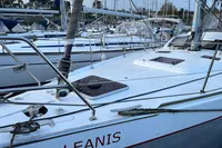 Sailboat Allures 45, 2012 model, docked in a marina with other boats.