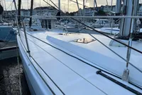 Sailboat Allures 45, 2012 model, docked in a marina with other boats.