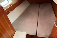 Cozy cabin interior of 2012 Allures 45 yacht with twin beds and wooden finish.