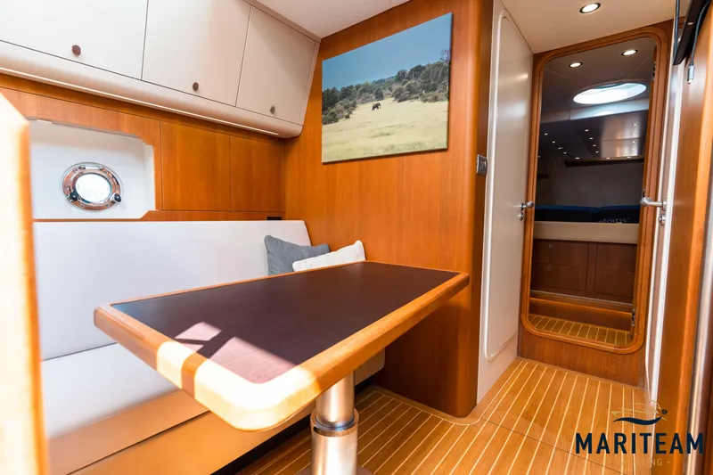 Onderonsie Yacht Photos Pics Interior of 2017 Breedendam MTB fourzero Wheelhouse, featuring elegant wood finish and cozy seating.