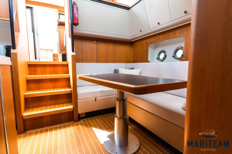 Onderonsie Yacht Photos Pics Interior of 2017 Breedendam MTB fourzero Wheelhouse with wooden finish and seating area.