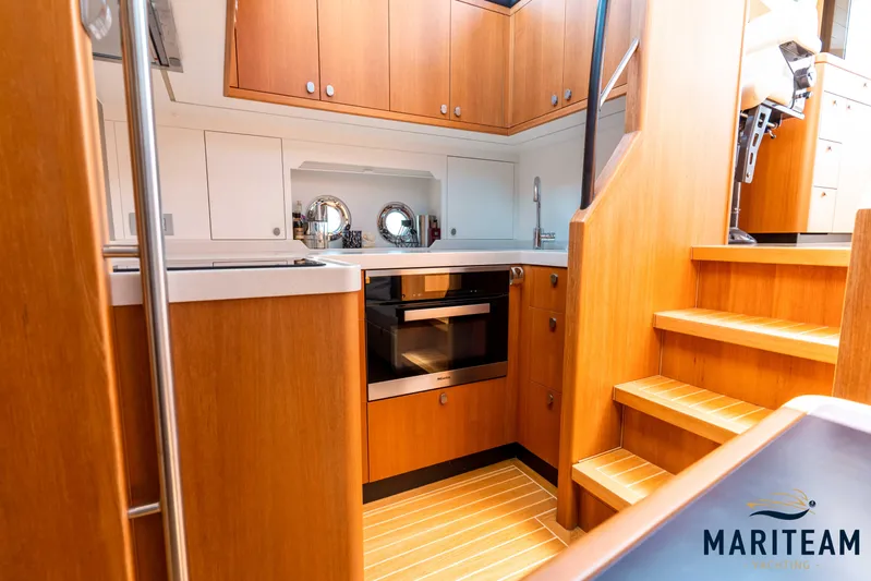 Onderonsie Yacht Photos Pics Interior of 2017 Breedendam MTB fourzero Wheelhouse with wooden cabinetry and stairs.