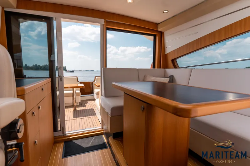 Onderonsie Yacht Photos Pics Interior of 2017 Breedendam MTB fourzero Wheelhouse yacht with elegant wood finish and seating.