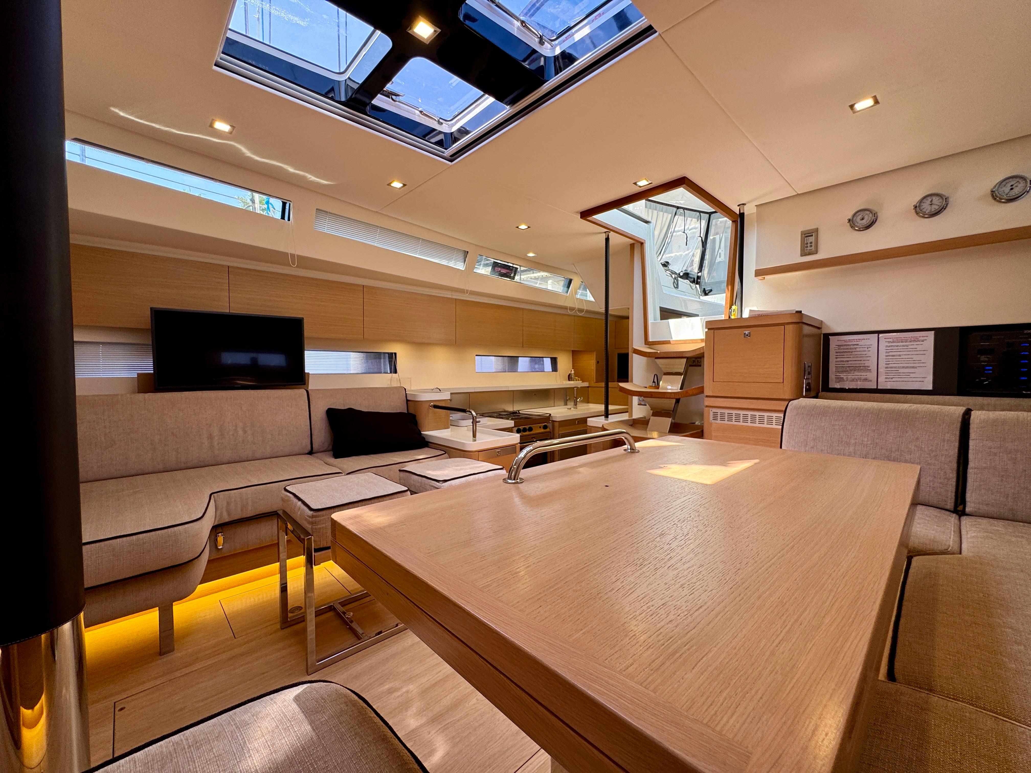 Luxurious interior of a 2017 Amel 50 yacht, featuring modern furnishings and ample natural light.