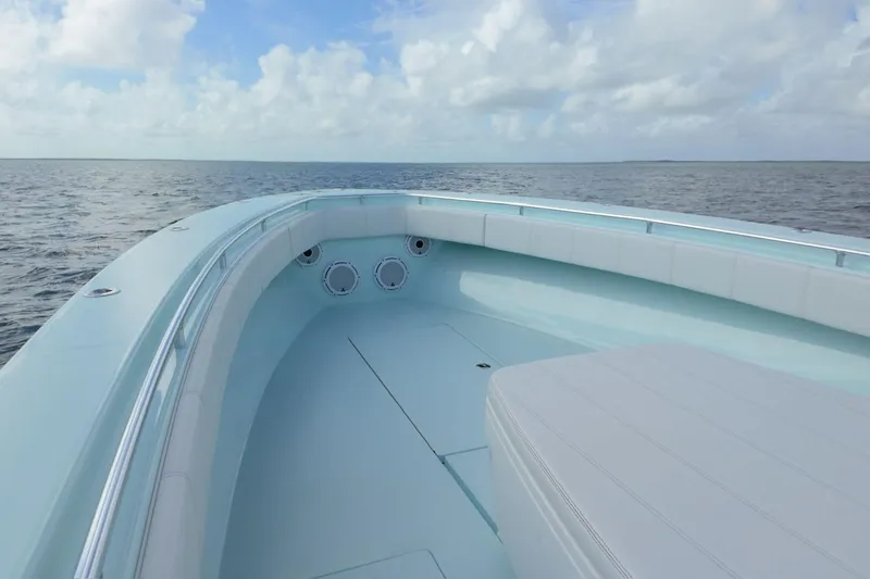  Yacht Photos Pics 2025 Contender 39 ST boat on open water under a cloudy sky.