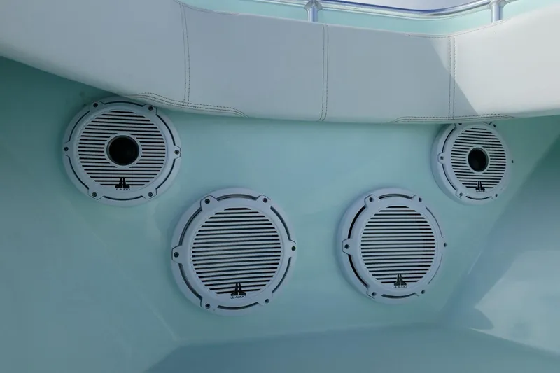  Yacht Photos Pics 2025 Contender 39 ST boat speakers with white grilles and cushioned seating.