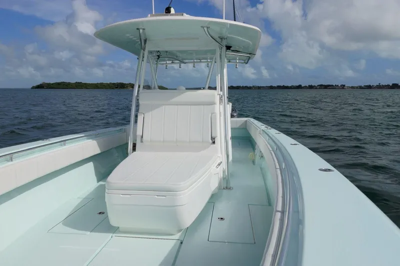  Yacht Photos Pics 2025 Contender 39 ST boat on open water under a cloudy sky.