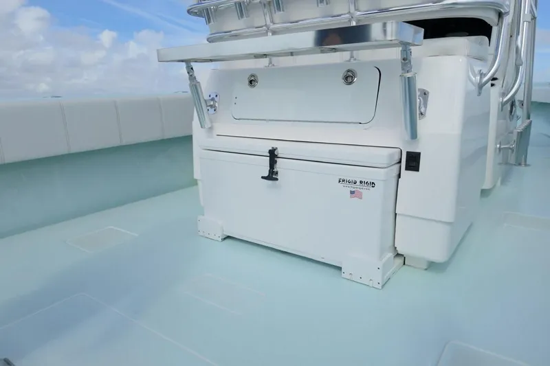  Yacht Photos Pics 2025 Contender 39 ST boat deck with storage compartment and stainless steel fixtures.