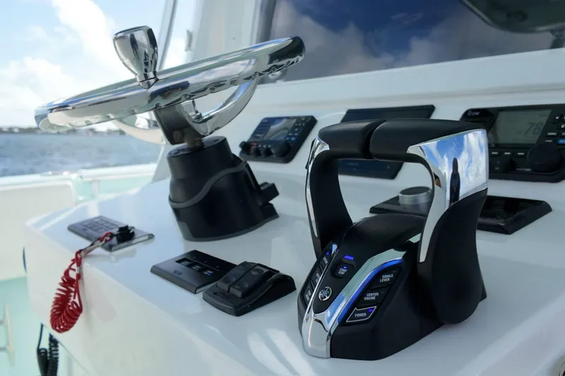  Yacht Photos Pics Helm of 2025 Contender 39 ST boat with modern controls and steering wheel.