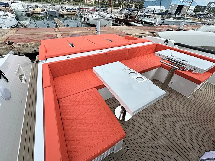  Yacht Photos Pics Luxurious seating area on 2025 De Antonio Yachts D50 with vibrant orange cushions.