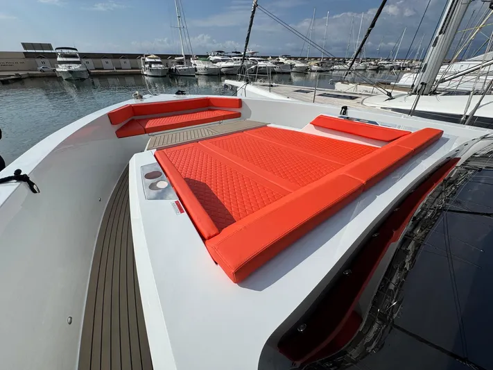  Yacht Photos Pics Luxury De Antonio Yachts D50, 2025 model, featuring vibrant orange seating on deck.