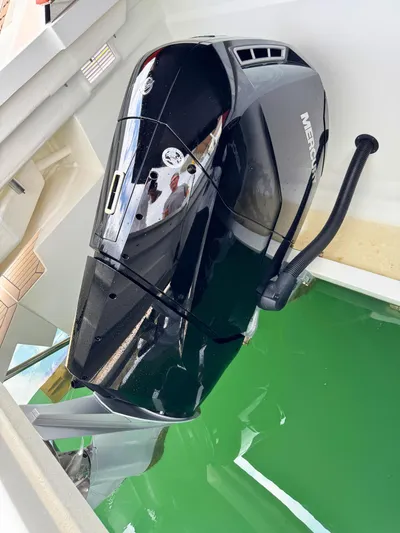  Yacht Photos Pics Mercury outboard motor on 2025 De Antonio Yachts D50, partially submerged in water.