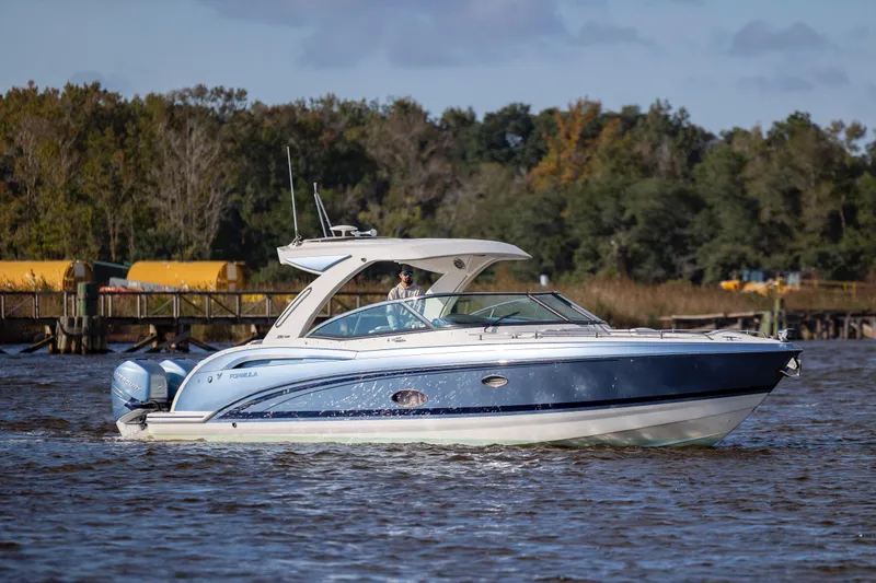  Yacht Photos Pics 2018 Formula 350 Crossover Bowrider OB cruising on a scenic river.