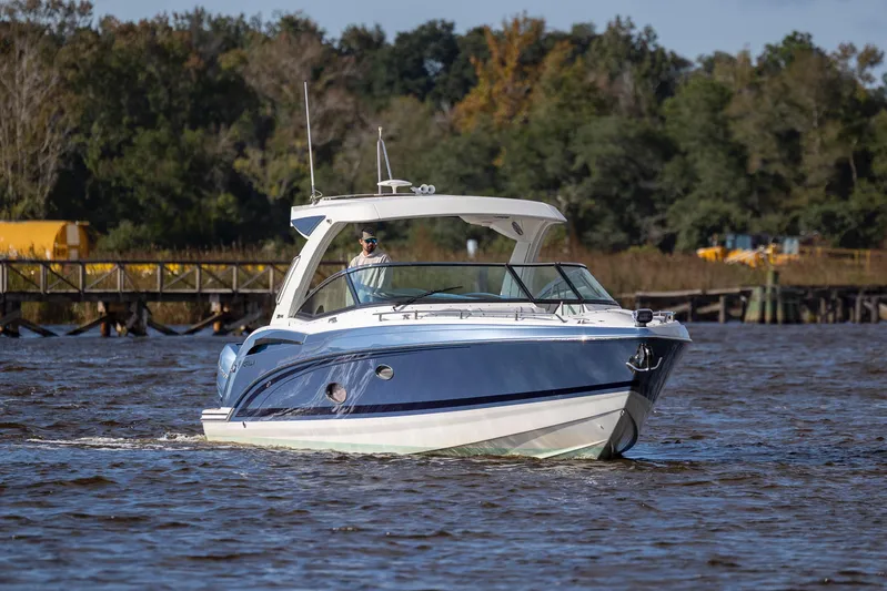  Yacht Photos Pics 2018 Formula 350 Crossover Bowrider OB cruising on a scenic river.