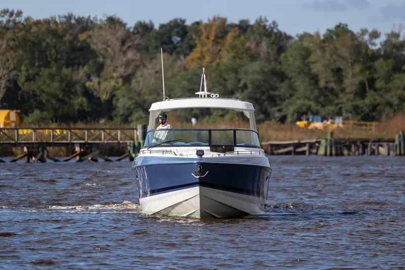  Yacht Photos Pics 2018 Formula 350 Crossover Bowrider OB cruising on a scenic river.