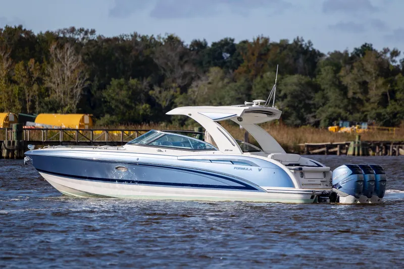  Yacht Photos Pics 2018 Formula 350 Crossover Bowrider OB cruising on a scenic waterway.
