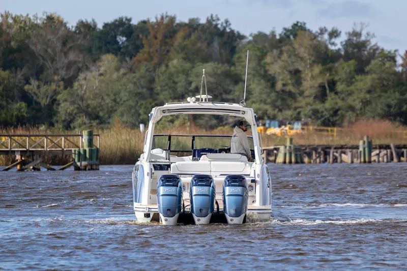  Yacht Photos Pics 2018 Formula 350 Crossover Bowrider OB cruising on a scenic river.