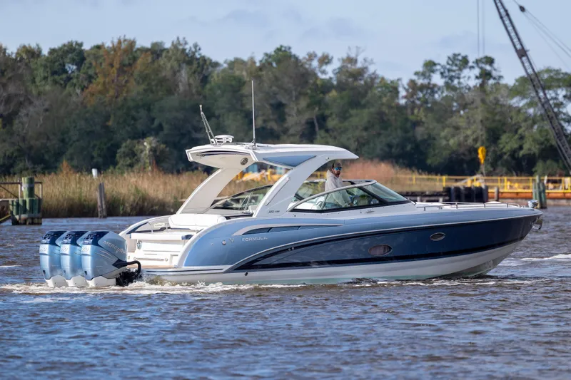  Yacht Photos Pics 2018 Formula 350 Crossover Bowrider OB cruising on a scenic waterway.