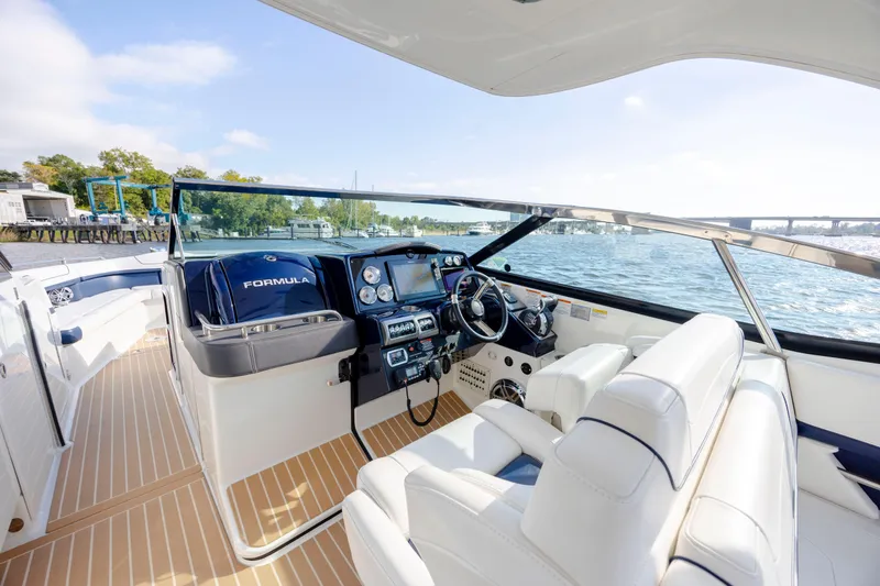  Yacht Photos Pics 2018 Formula 350 Crossover Bowrider OB interior with luxurious seating and modern dashboard on water.