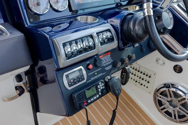  Yacht Photos Pics Control panel of 2018 Formula 350 Crossover Bowrider OB with gauges and radio equipment.