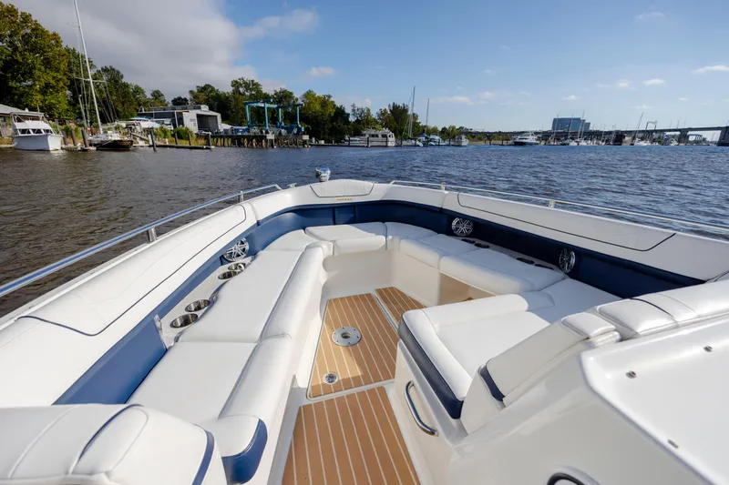  Yacht Photos Pics 2018 Formula 350 Crossover Bowrider OB on a scenic river, featuring spacious seating.
