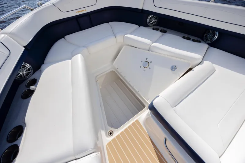  Yacht Photos Pics 2018 Formula 350 Crossover Bowrider OB interior with white seating and storage compartment.