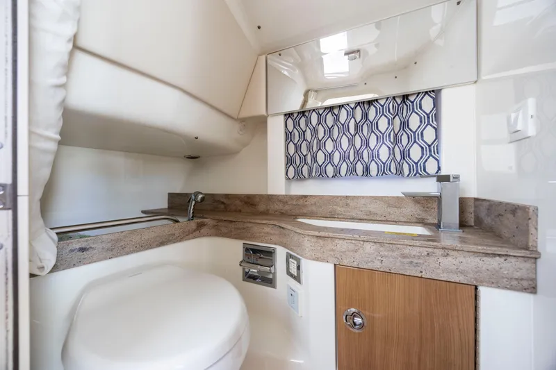  Yacht Photos Pics 2018 Formula 350 Crossover Bowrider OB bathroom with modern sink and patterned curtain.