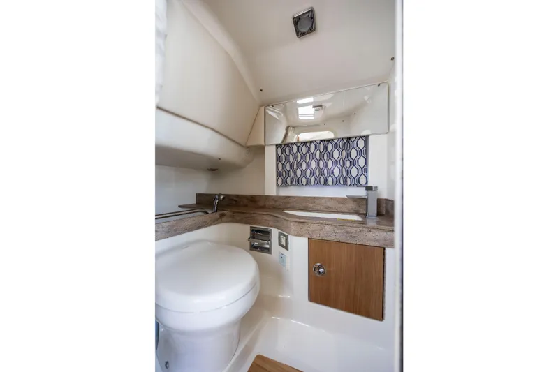  Yacht Photos Pics 2018 Formula 350 Crossover Bowrider OB bathroom with modern design and compact amenities.