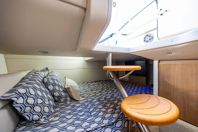  Yacht Photos Pics 2018 Formula 350 Crossover Bowrider OB cabin interior with patterned bedding and modern design.